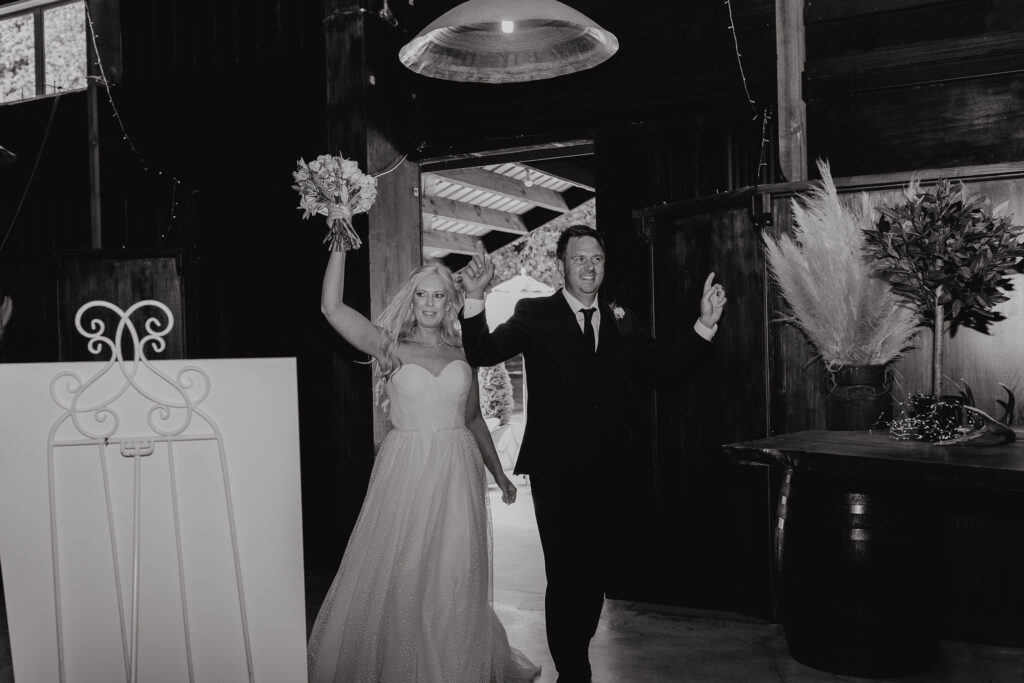 Bride and Groom walking into reception